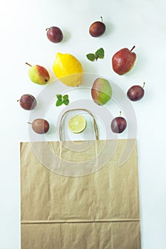 Healthy food in a kraft paper bag. Zero waste concept, colorful reusable eco bags