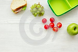 Healthy food in lunchbox for dinner at school white table background top view mockup