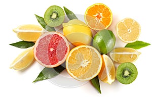 healthy food. mix sliced lemon, green lime, orange, mandarin, kiwi fruit and grapefruit with green leaf on white