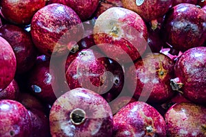 Healthy food, pomegranates background Garnets