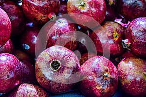Healthy food, pomegranates background Garnets