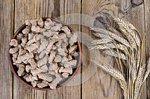 Healthy food products. Extruded rye bran on white background