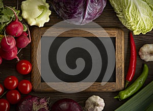 Healthy food. Raw organic vegetables and fruits. On wooden background. Top view. Copy space