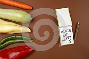 Healthy Food: Raw vegetables and message `Healthy and Happy :`