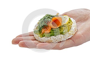 Healthy food rice cake sandwich on hand. Rice cookies sandwich isolated on white background. Rice cakes with mozzarella