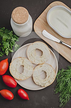 Healthy food with round toast, bottle, vegetables and cheese/Healthy food with round toast, bottle, vegetables and cheese on black