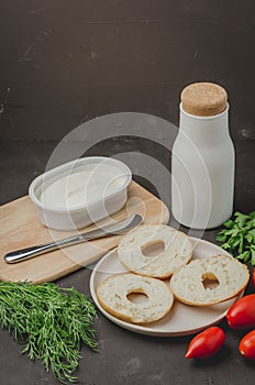 Healthy food with round toast, bottle, vegetables and cheese/Healthy food with round toast, bottle, vegetables and cheese on black