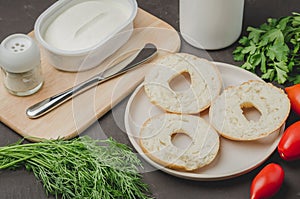 Healthy food with round toast, bottle, vegetables and cheese/Healthy food with round toast, bottle, vegetables and cheese on black