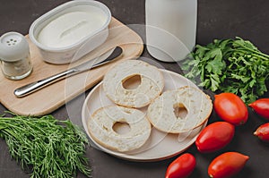 Healthy food with round toast, bottle, vegetables and cheese/Healthy food with round toast, bottle, vegetables and cheese on black