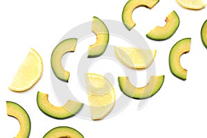 healthy food. sliced avocado with lemon isolated on white background. top view