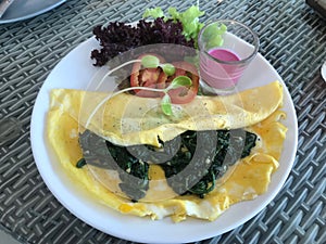 Healthy Food Spinach Omelette and Salad with Fruit Sauce Dressing.