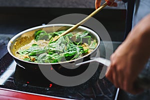 Healthy food, the stages of cooking vegetarian pasta with mushrooms and vegetables. Soft focus.