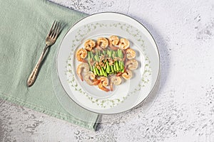 Healthy food stir fried shrimp asparagus in plate on white slate table