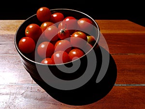 Healthy food: sunlit tomatoes in bowl