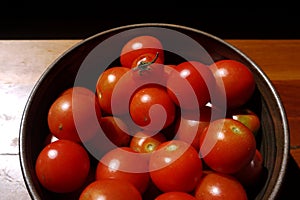 Healthy food: sunlit tomatoes in bowl detail