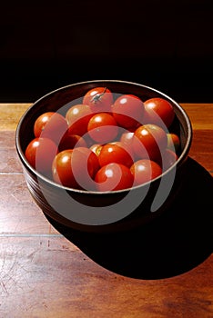 Healthy food: sunlit tomatoes in bowl - v