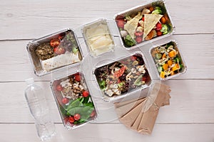 Healthy food take away, top view at wood background