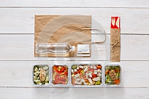 Healthy food take away, top view at wood background