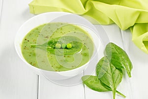 Healthy food vegan soup with asparagus and spinach and green peas.