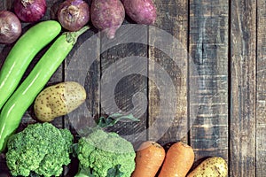 Healthy food vegetable on wood background has broccoli potato onion eggplant carrot copy space top view