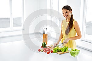 Healthy Food. Woman Cutting Vegetables. Salad, Food Preparation.