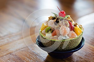 healthy fresh Delicious fruits salad in plate on table close-up