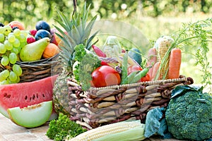 Healthy fresh food in healthy diet, organic fruit and vegetable in wicker basket on table