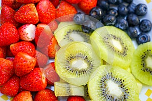 Healthy fresh fruit strawberry, raspberry, blueberry, kiwi