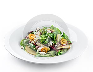 Healthy fresh salad with mix greens, apple, cream cheese, cranberry, sauce and edible flowers in plate on isolated white