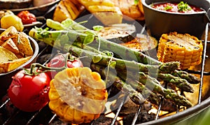 Healthy fresh summer vegetables grilling on a BBQ photo