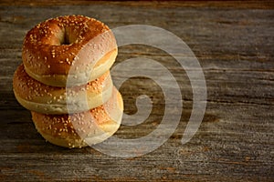 Healthy freshly baked bagels on wooden background