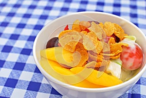 Healthy fruit salad topped with cereal