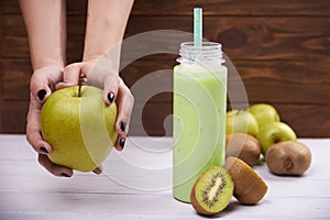 Healthy fruit smoothie on rustic wood table.