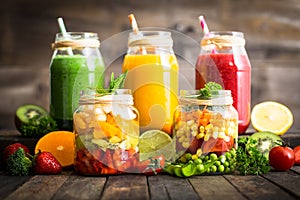 Healthy fruit and vegetable salad and smoothies