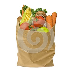 Healthy fruit and vegetables in a brown paper bag, isolated on a