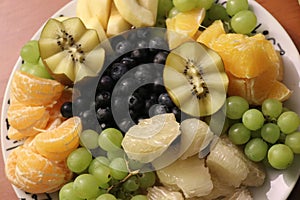 healthy fruits, decoration,. kiwi, grapes, oraynges, blueberries, pomelo