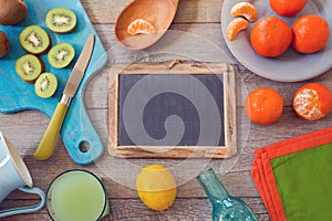 Healthy fruits and juice on wooden table. View from above