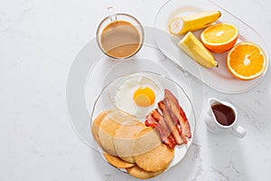 Healthy Full American Breakfast with Eggs Bacon and Pancakes