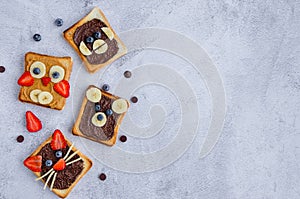 Healthy funny face sandwiches for kids. Animal faces toast with peanut and hazelnat chocolate butter