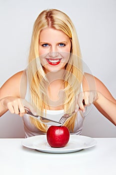 Healthy Girl eating an red apple