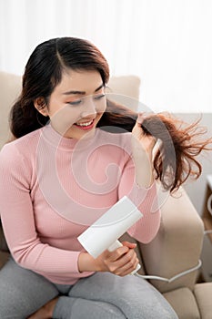 Healthy girl with hair dryer isolated