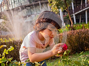 Healthy girl smiling and enjoying life. playing and learning from the nature.