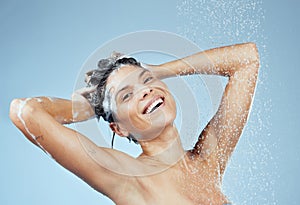 Healthy, good looking hair starts with a shower. Studio portrait of an attractive young woman washing her hair while