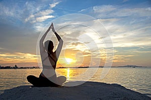 Healthy Good. Meditation yoga lifestyle woman silhouette on the Sea sunset, relax vital