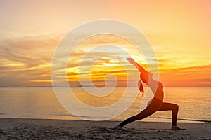 Healthy Good. Meditation yoga lifestyle woman silhouette on the Sea sunset