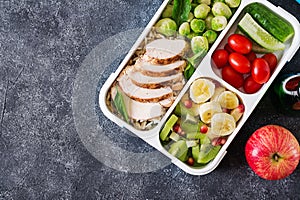 Healthy green meal prep containers with chicken fillet, rice, brussels sprouts