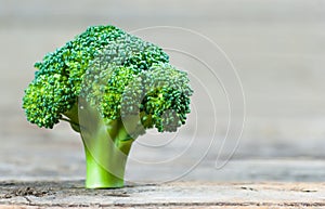 Healthy Green Organic Raw Broccoli on wooden background