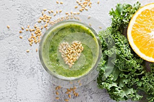 Healthy green smoothie with heart of seeds linseed