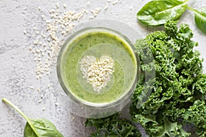 Healthy green smoothie with heart of seeds sesame
