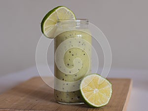 Healthy green smoothie with spinach and lime